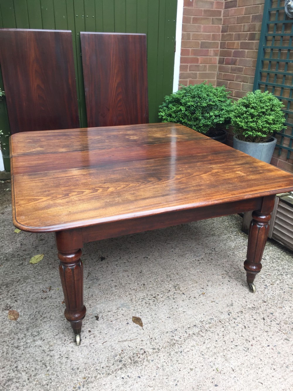 Early C19th Regency period mahogany extending dining table with 3 original additional leaves . View XVI