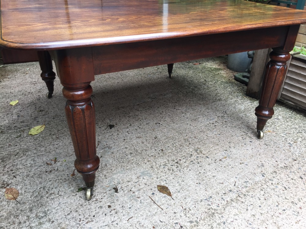 Early C19th Regency period mahogany extending dining table with 3 original additional leaves . View XVIII