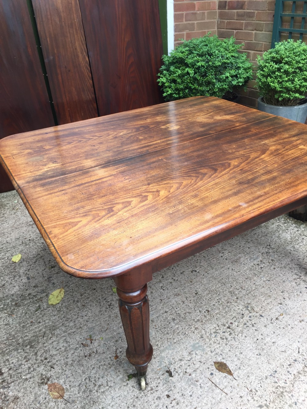 Early C19th Regency period mahogany extending dining table with 3 original additional leaves . View XIX