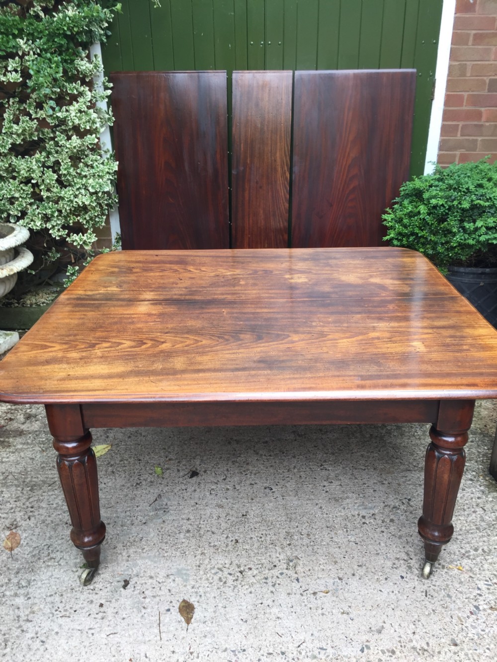 Early C19th Regency period mahogany extending dining table with 3 original additional leaves . View XX