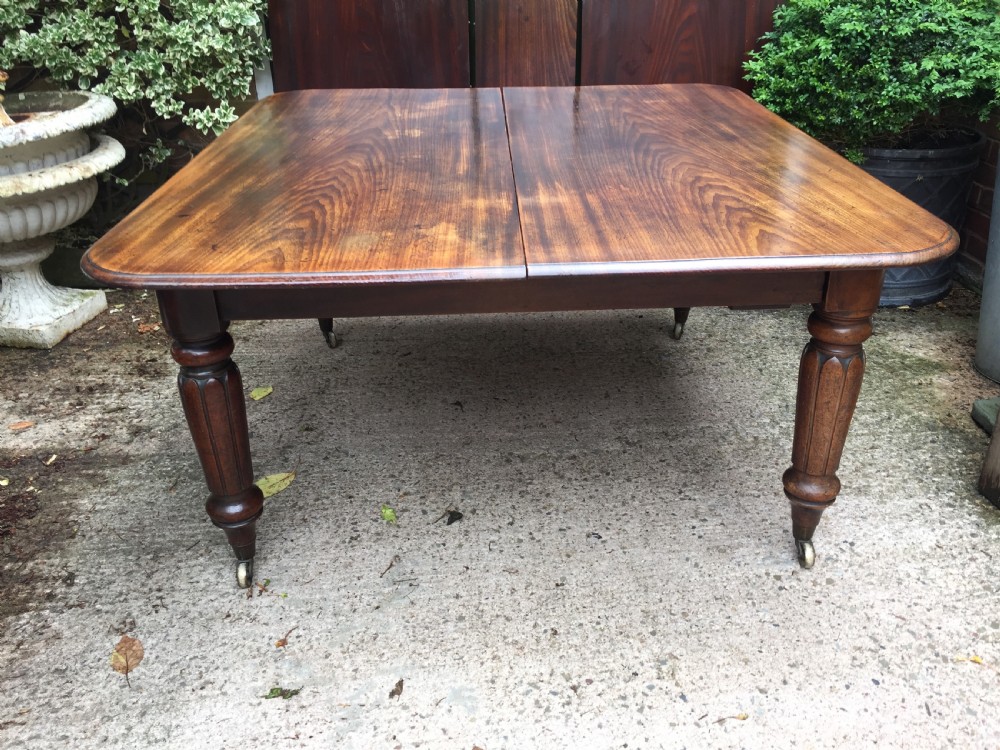 Early C19th Regency period mahogany extending dining table with 3 original additional leaves . View XXI