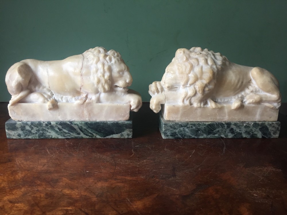 Pair of C19th Italian carved alabaster 'Grand Tour' souvenir lions after Antonio Canova . View II