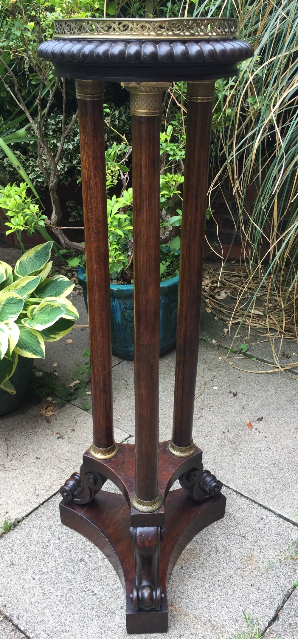 Early C19th George IV period gilt-brass mounted rosewood torchere  of Empire design.