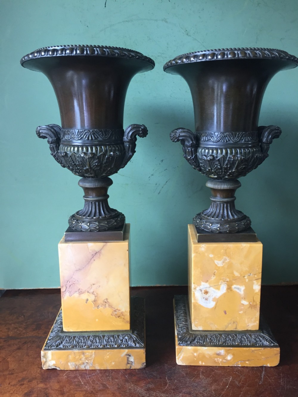 Pair of French early C19th Charles X period bronze campana shaped urns on siena marble plinth bases. View III