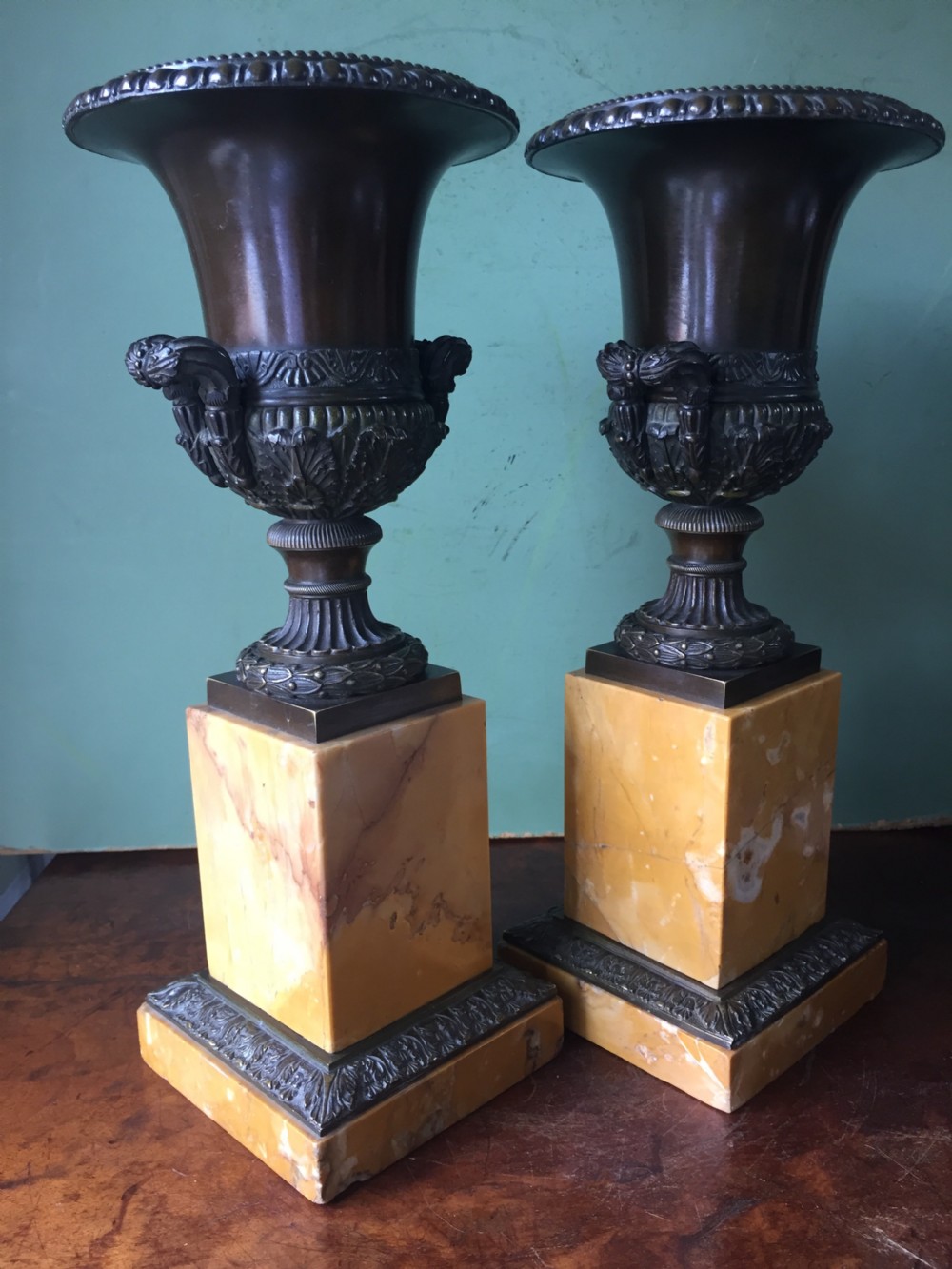 Pair of French early C19th Charles X period bronze campana shaped urns on siena marble plinth bases. View V
