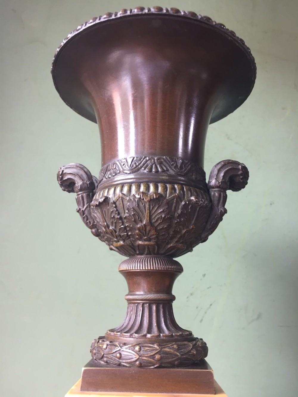 Pair of French early C19th Charles X period bronze campana shaped urns on siena marble plinth bases. View VI