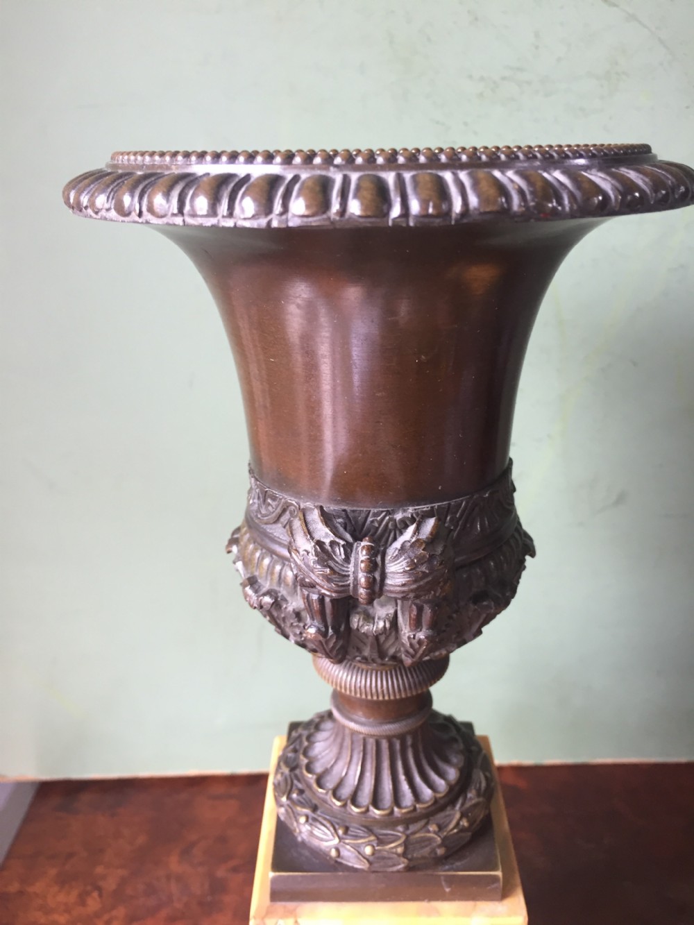 Pair of French early C19th Charles X period bronze campana shaped urns on siena marble plinth bases. View VII