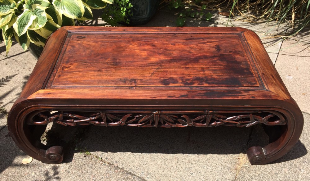 Late C19th Chinese Qing Dynasty carved hardwood 'kang' or opium table of scroll-end design. View II