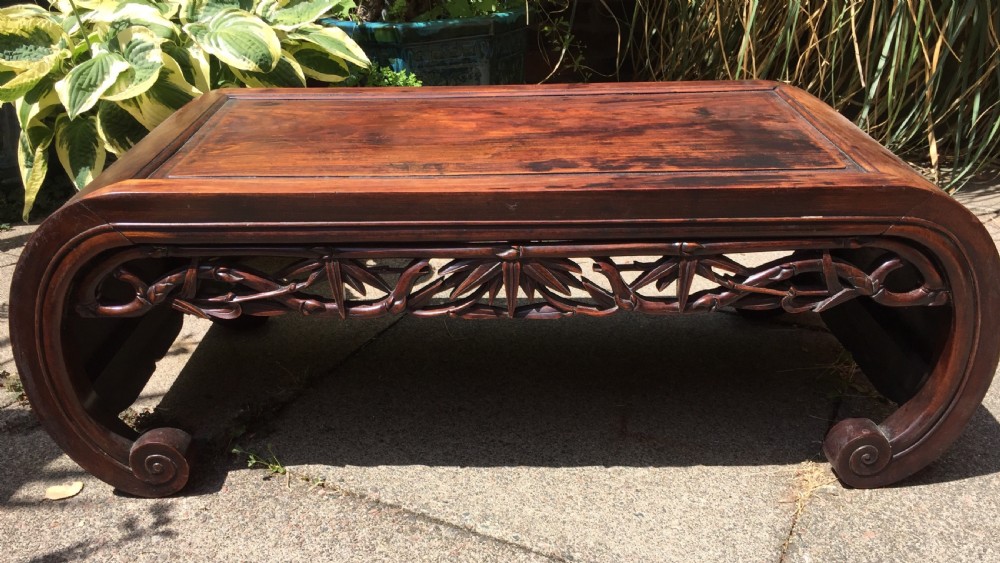 Late C19th Chinese Qing Dynasty carved hardwood 'kang' or opium table of scroll-end design. View III