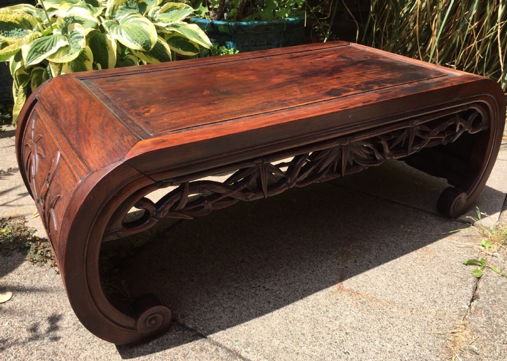 Late C19th Chinese Qing Dynasty carved hardwood 'kang' or opium table of scroll-end design. View IX