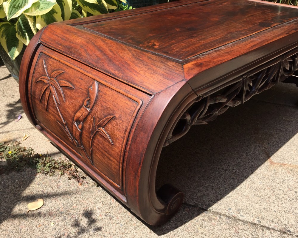 Late C19th Chinese Qing Dynasty carved hardwood 'kang' or opium table of scroll-end design. View X