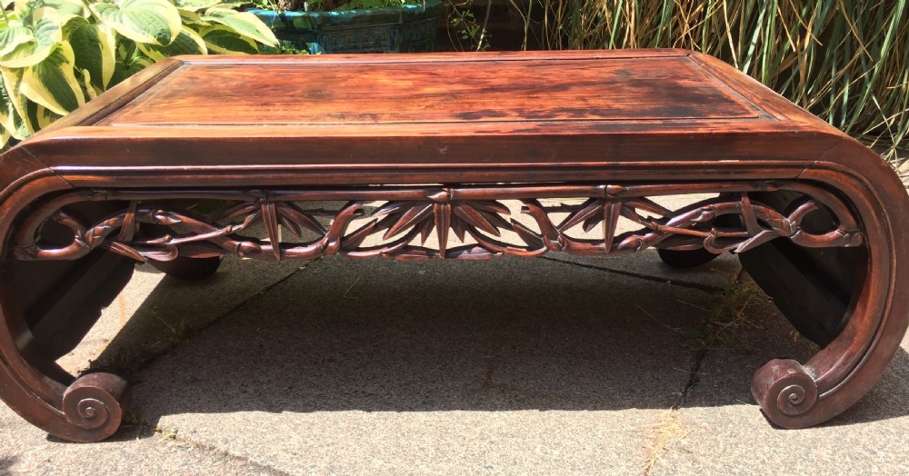 Late C19th Chinese Qing Dynasty carved hardwood 'kang' or opium table of scroll-end design. View XIV