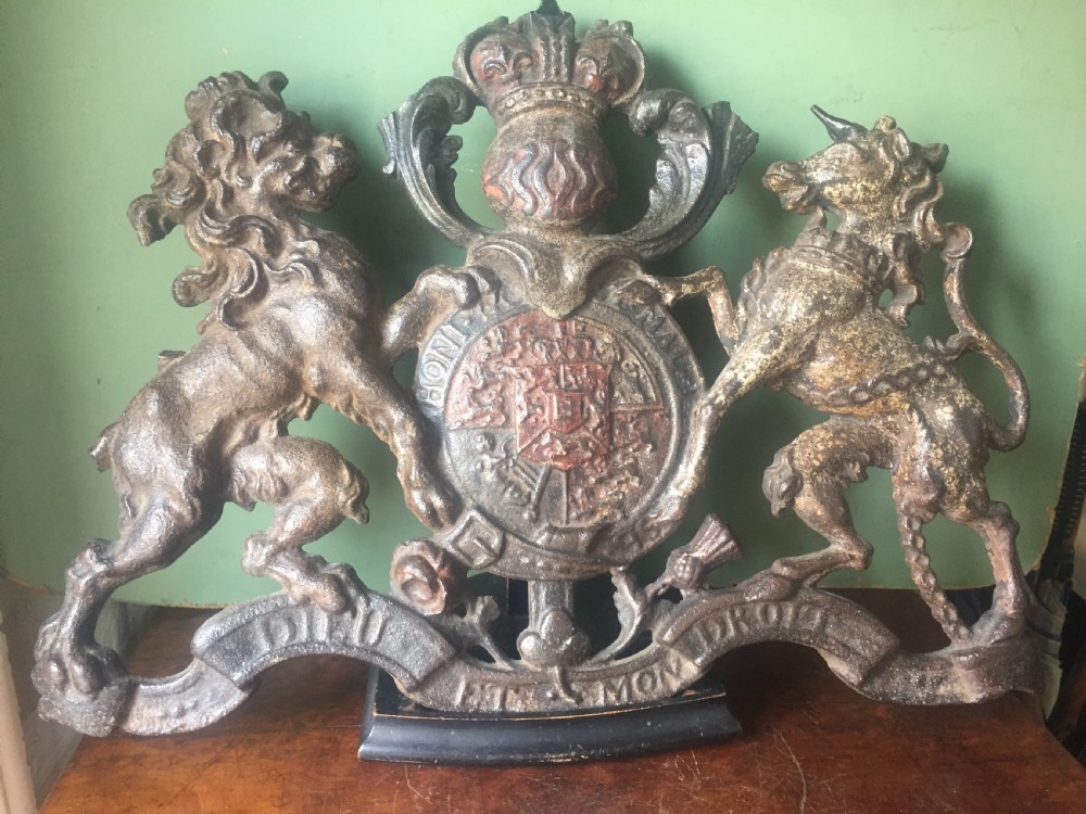 Mid C19th British cast-iron 'coat of arms' or Royal cypher with traces of original polychrome painted decoration. View III