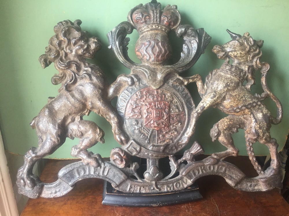Mid C19th British cast-iron 'coat of arms' or Royal cypher with traces of original polychrome painted decoration. View IV