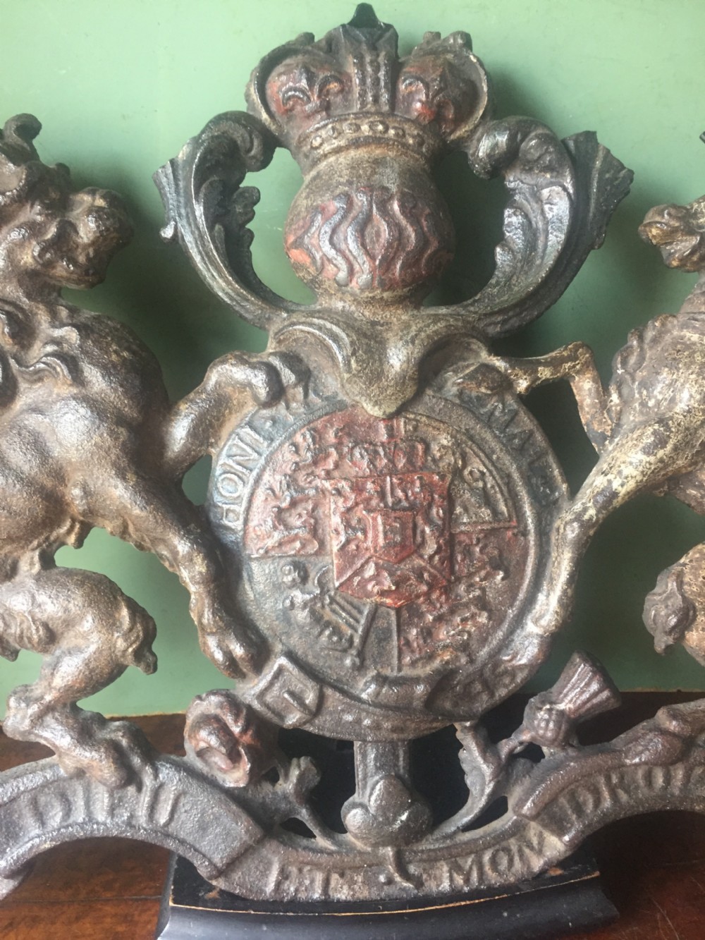 Mid C19th British cast-iron 'coat of arms' or Royal cypher with traces of original polychrome painted decoration. View X