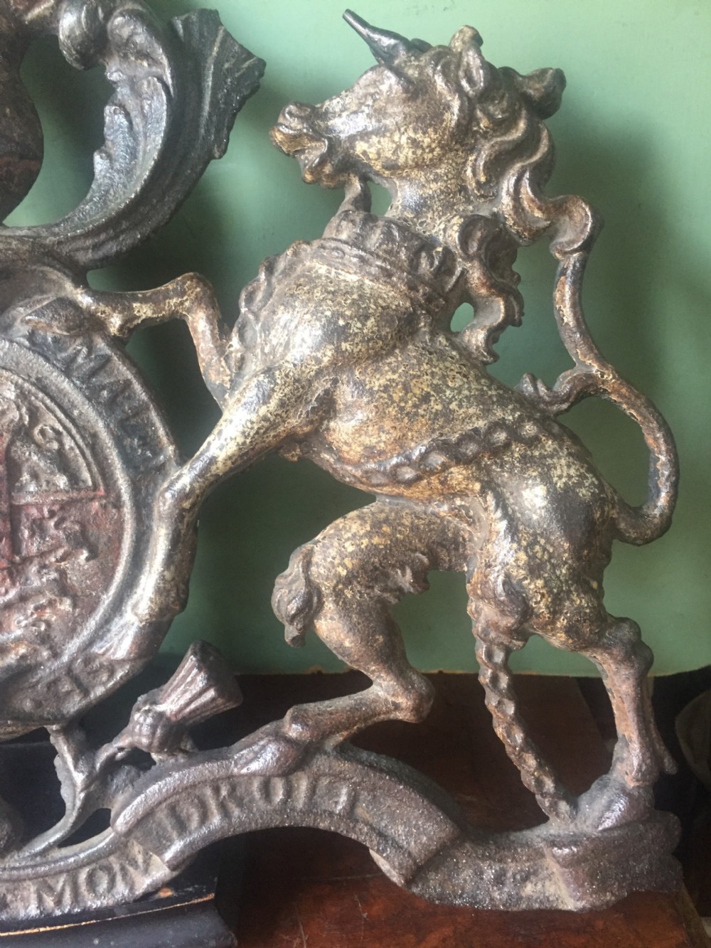 Mid C19th British cast-iron 'coat of arms' or Royal cypher with traces of original polychrome painted decoration. View XI