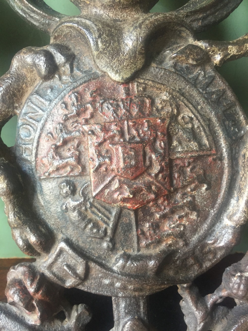 Mid C19th British cast-iron 'coat of arms' or Royal cypher with traces of original polychrome painted decoration. View XIV