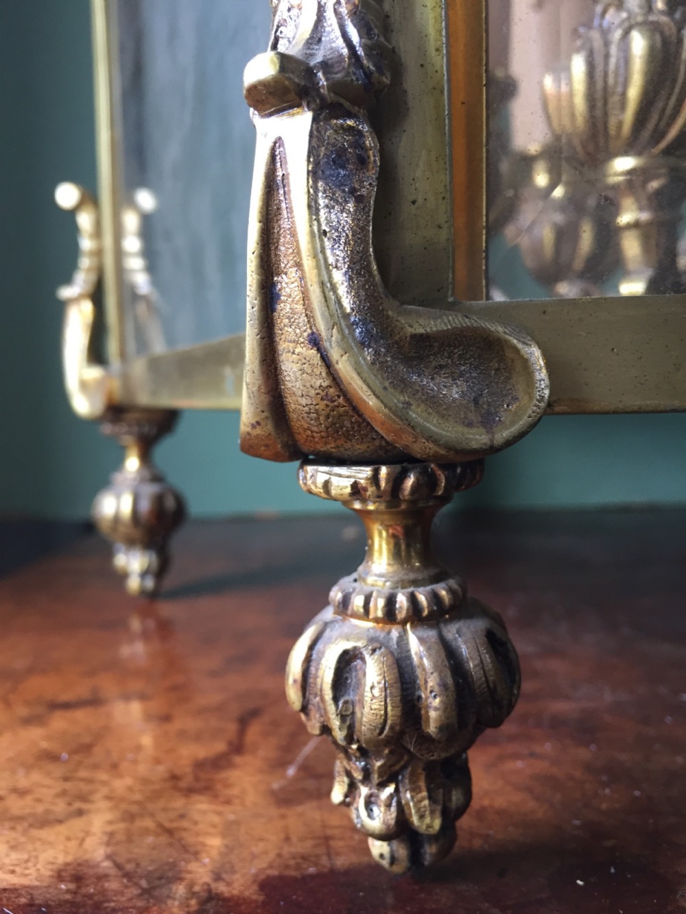 A late nineteenth-century French gilded brass hexagonal hall lantern featuring curved glass panels and acanthus leaf ornamentation. View VIII