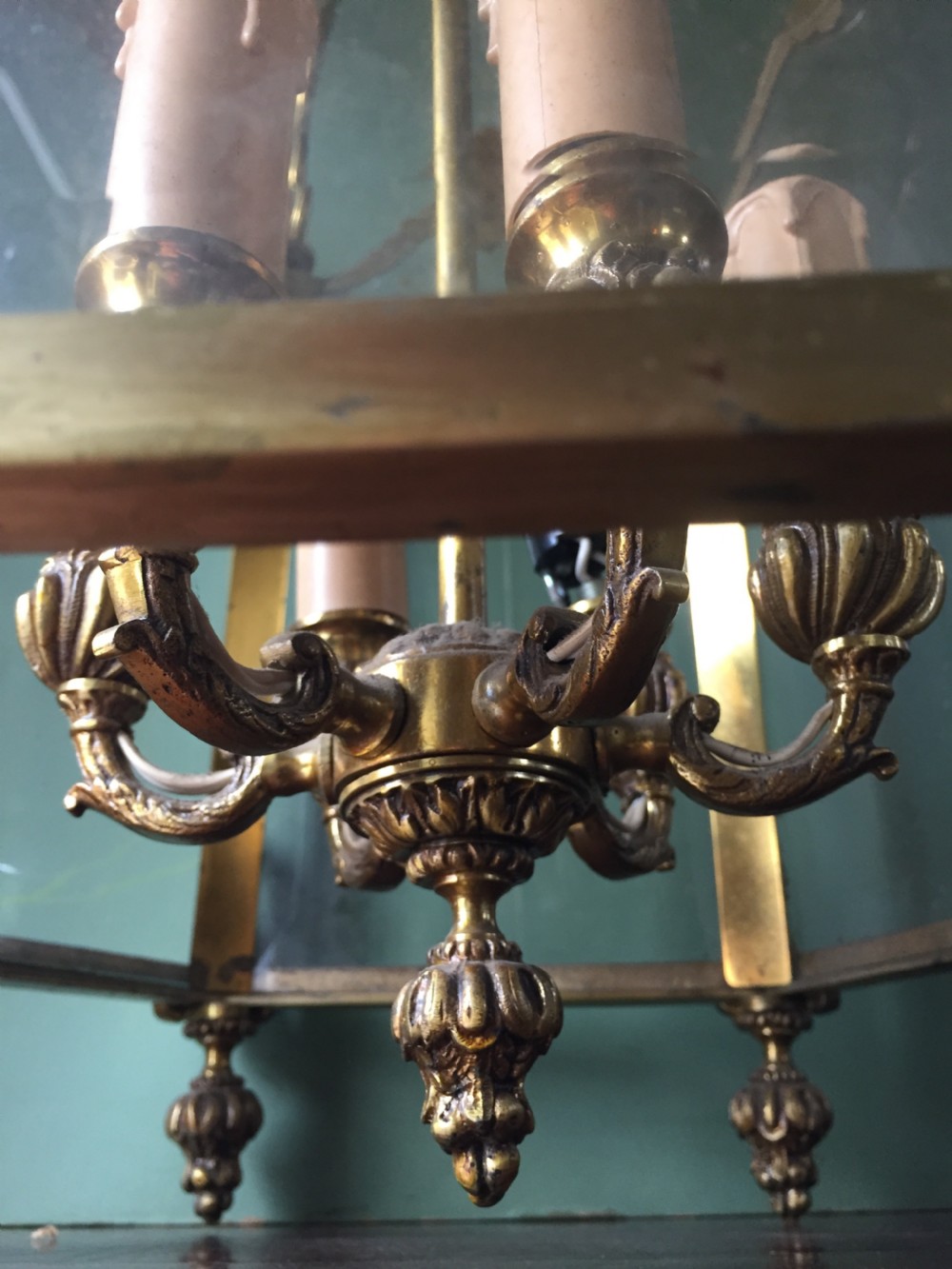 A late nineteenth-century French gilded brass hexagonal hall lantern featuring curved glass panels and acanthus leaf ornamentation. View IX