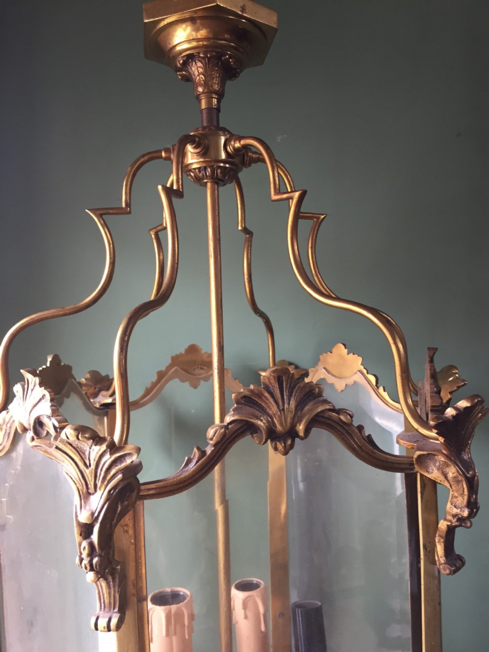 A late nineteenth-century French gilded brass hexagonal hall lantern featuring curved glass panels and acanthus leaf ornamentation. View XIII