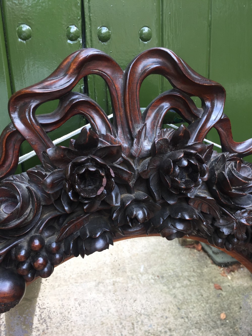 Exceptional mid C19th Indo-Portuguese carved rosewood or padauk framed oval mirror. View V