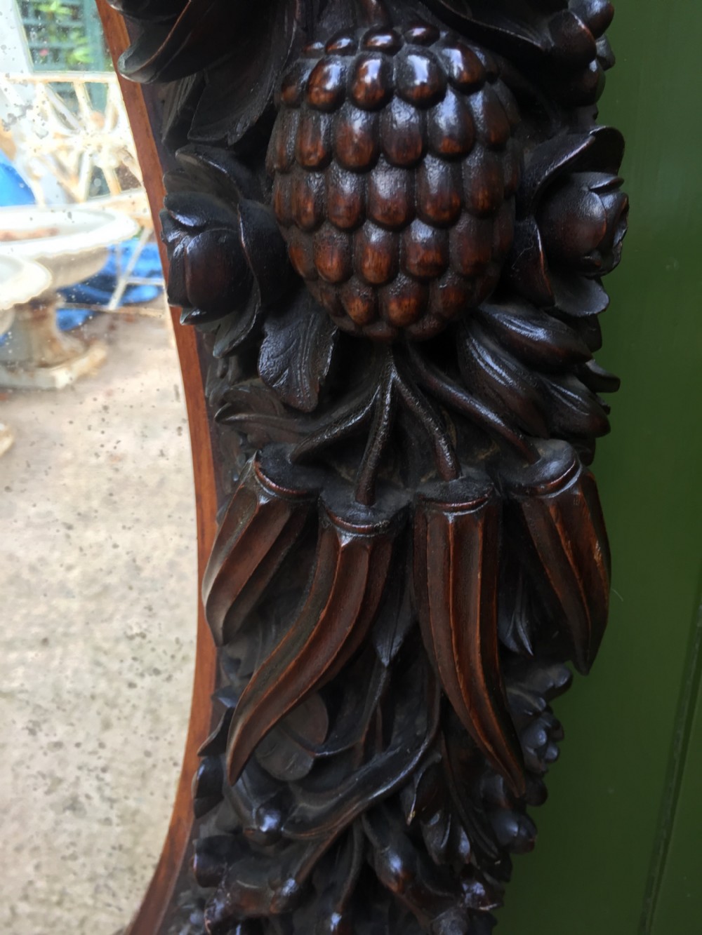 Exceptional mid C19th Indo-Portuguese carved rosewood or padauk framed oval mirror. View IX