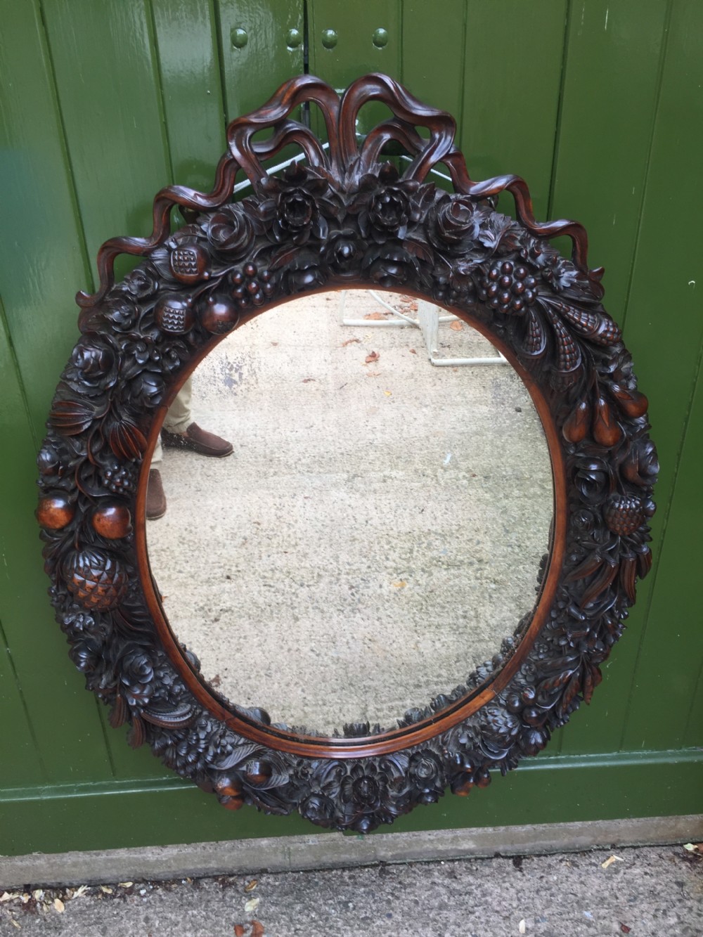 Exceptional mid C19th Indo-Portuguese carved rosewood or padauk framed oval mirror. View XII