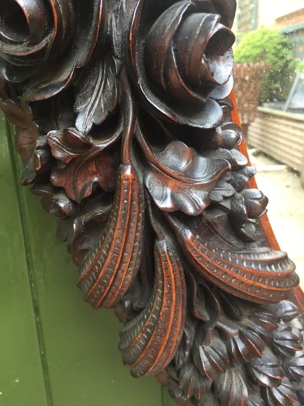 Exceptional mid C19th Indo-Portuguese carved rosewood or padauk framed oval mirror. View XV