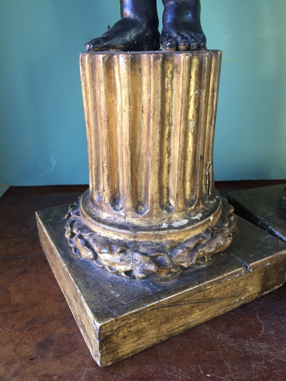 Pair of early C19th Italian carved wood amorini or cherubs modelled as lamps raised on truncated fluted column bases. View V