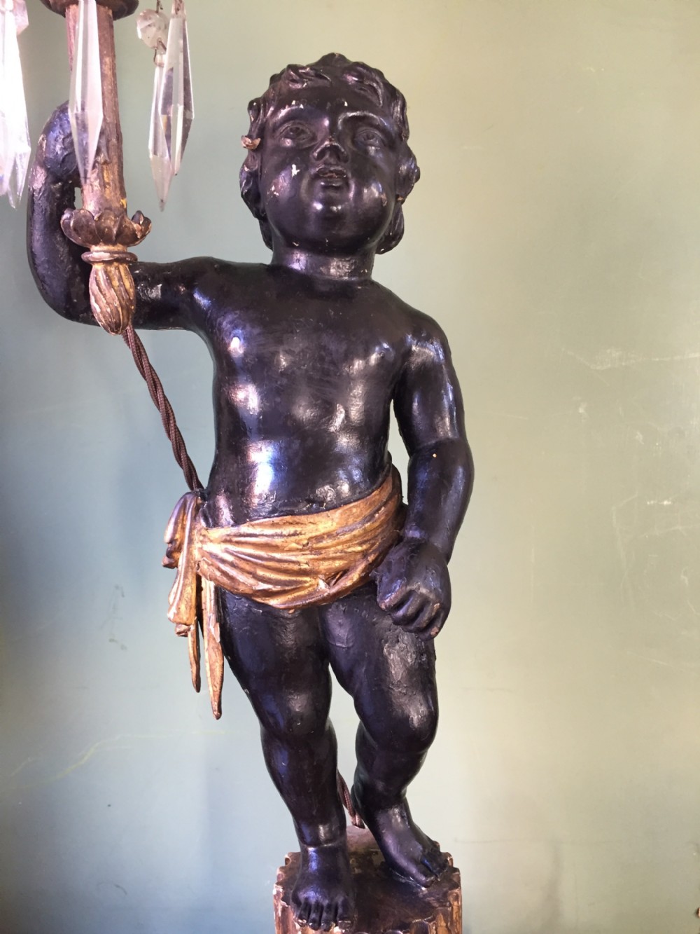 Pair of early C19th Italian carved wood amorini or cherubs modelled as lamps raised on truncated fluted column bases. View VIII