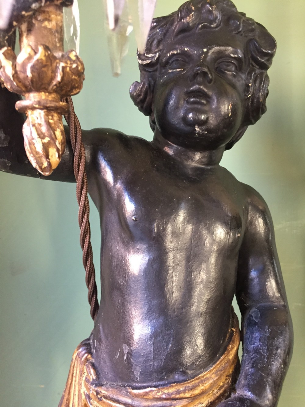 Pair of early C19th Italian carved wood amorini or cherubs modelled as lamps raised on truncated fluted column bases. View XII