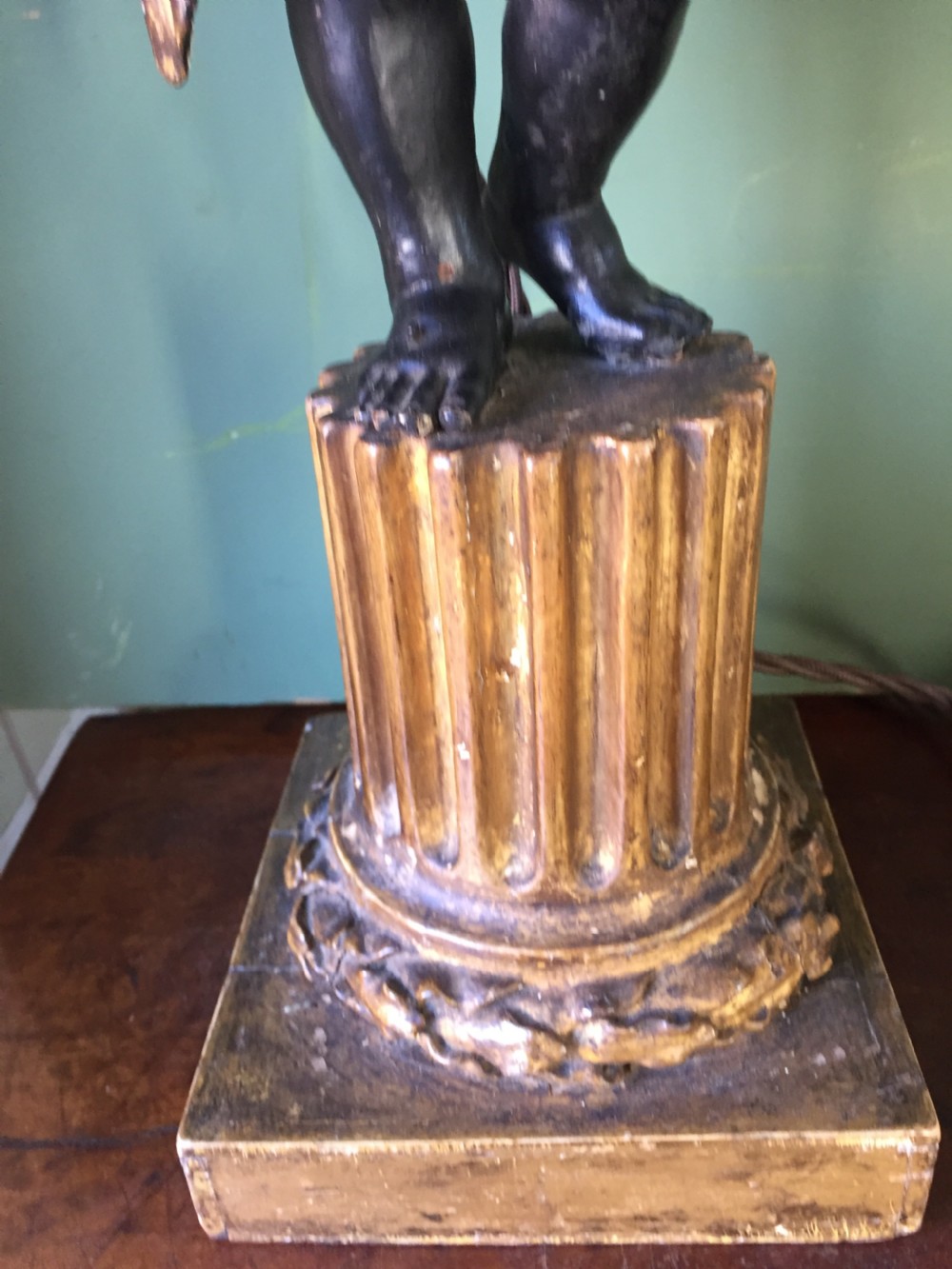 Pair of early C19th Italian carved wood amorini or cherubs modelled as lamps raised on truncated fluted column bases. View XIII