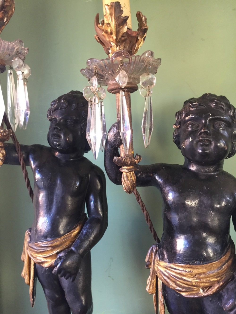 Pair of early C19th Italian carved wood amorini or cherubs modelled as lamps raised on truncated fluted column bases. View XVI