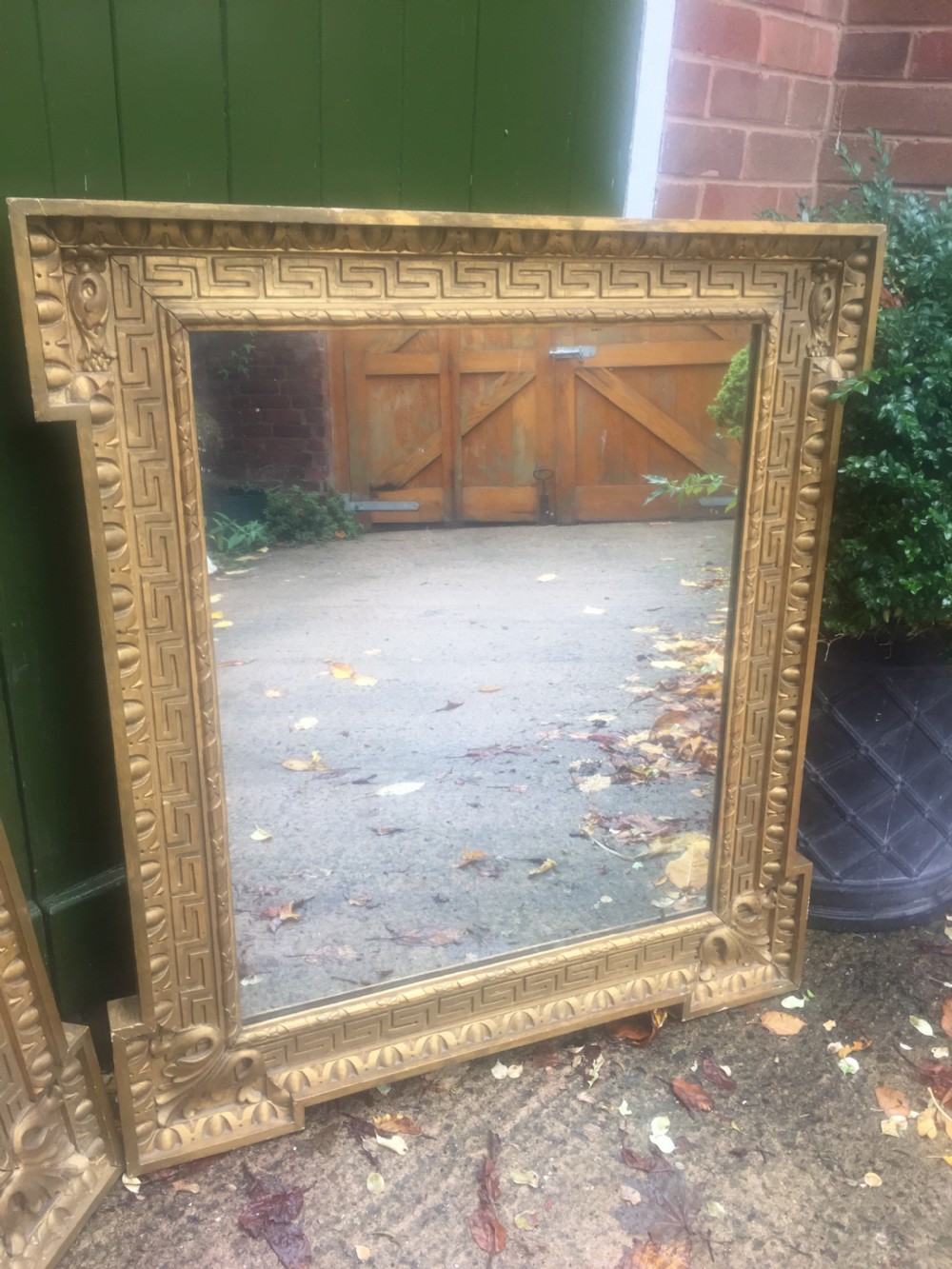 Pair of early C19th Georgian revival gilt-framed mirrors in the manner of William Kent in the Palladian architectural style . View III
