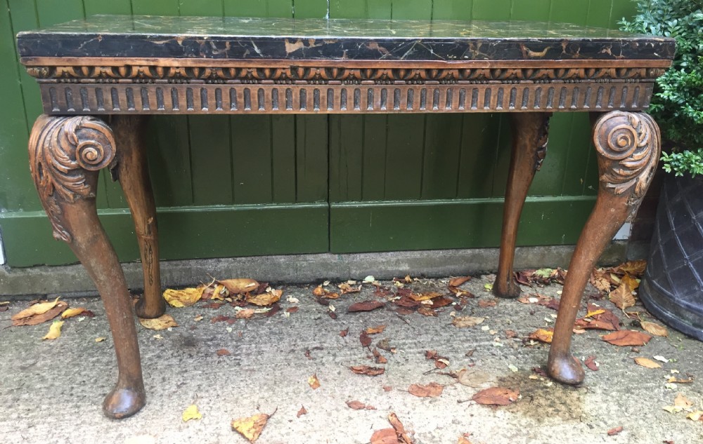 Interesting and decorative C18th George II period style carved and polished pine pier table with a faux marble slab top. View II