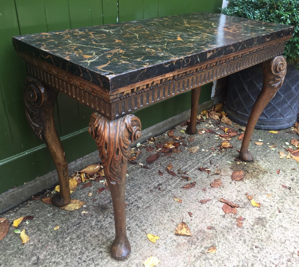 Interesting and decorative C18th George II period style carved and polished pine pier table with a faux marble slab top. View V