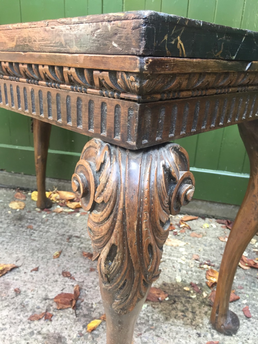 Interesting and decorative C18th George II period style carved and polished pine pier table with a faux marble slab top. View VIII