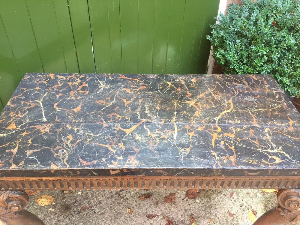 Interesting and decorative C18th George II period style carved and polished pine pier table with a faux marble slab top. View X