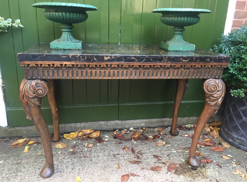 Interesting and decorative C18th George II period style carved and polished pine pier table with a faux marble slab top. View XVI