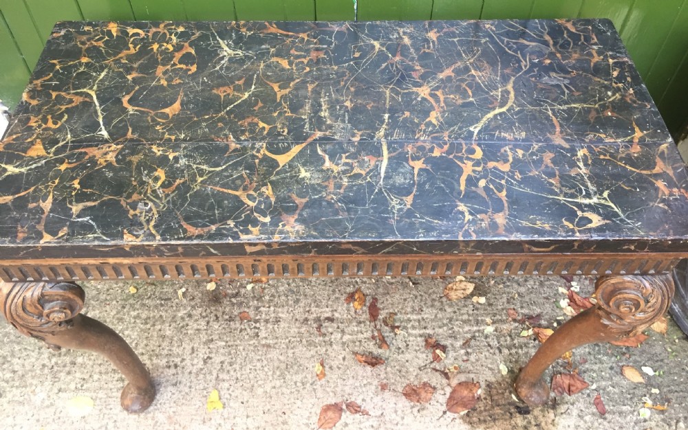 Interesting and decorative C18th George II period style carved and polished pine pier table with a faux marble slab top. View XVIII