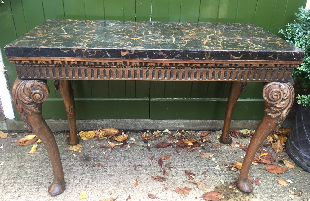Interesting and decorative C18th George II period style carved and polished pine pier table with a faux marble slab top. View XIX