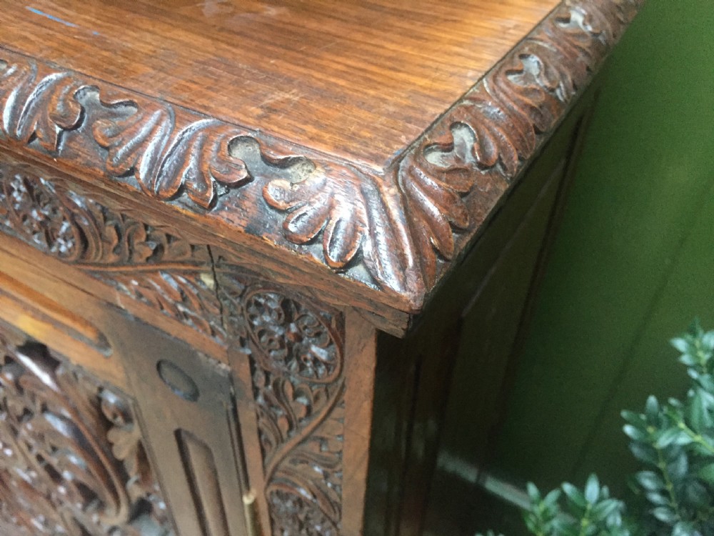 Mid C19th Anglo-Indian carved padauk or rosewood dwarf bookcase or side cabinet . View IV