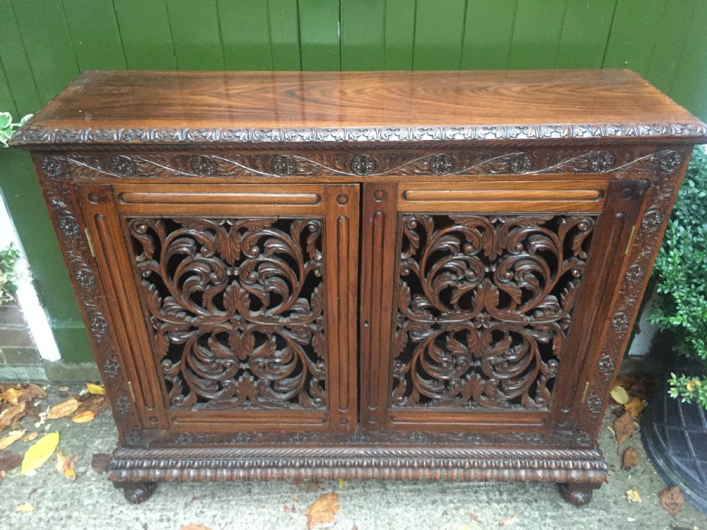 Mid C19th Anglo-Indian carved padauk or rosewood dwarf bookcase or side cabinet . View VII