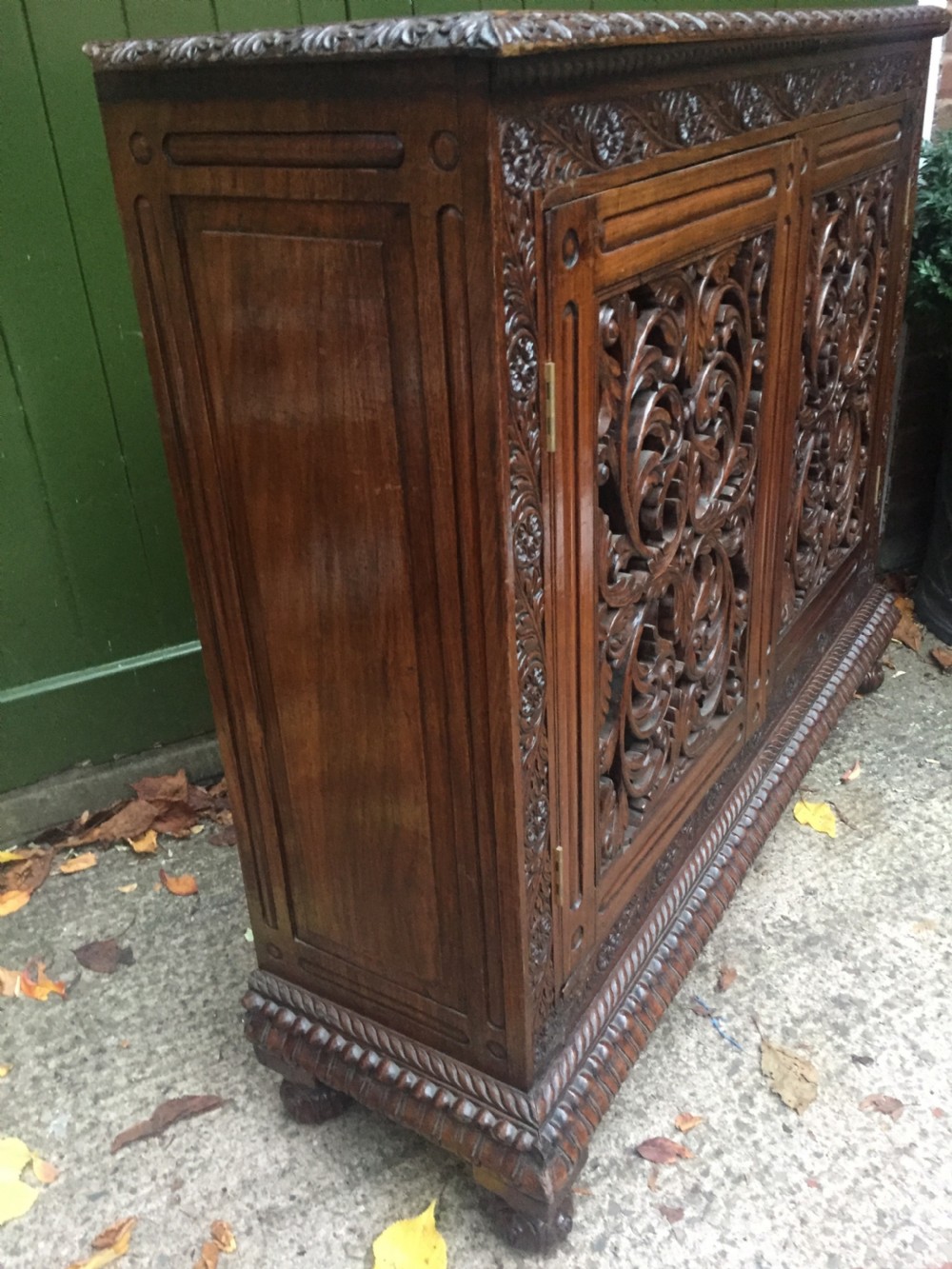 Mid C19th Anglo-Indian carved padauk or rosewood dwarf bookcase or side cabinet . View VIII
