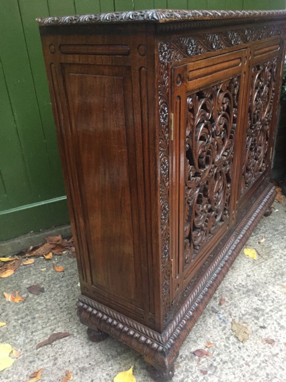 Mid C19th Anglo-Indian carved padauk or rosewood dwarf bookcase or side cabinet . View IX