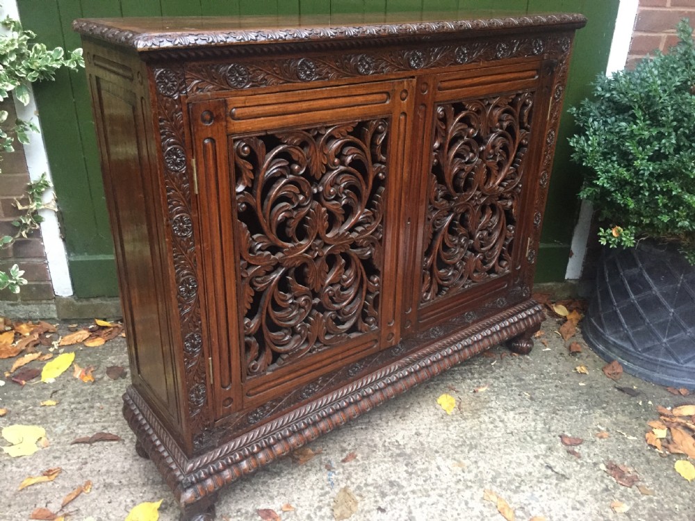 Mid C19th Anglo-Indian carved padauk or rosewood dwarf bookcase or side cabinet . View XII