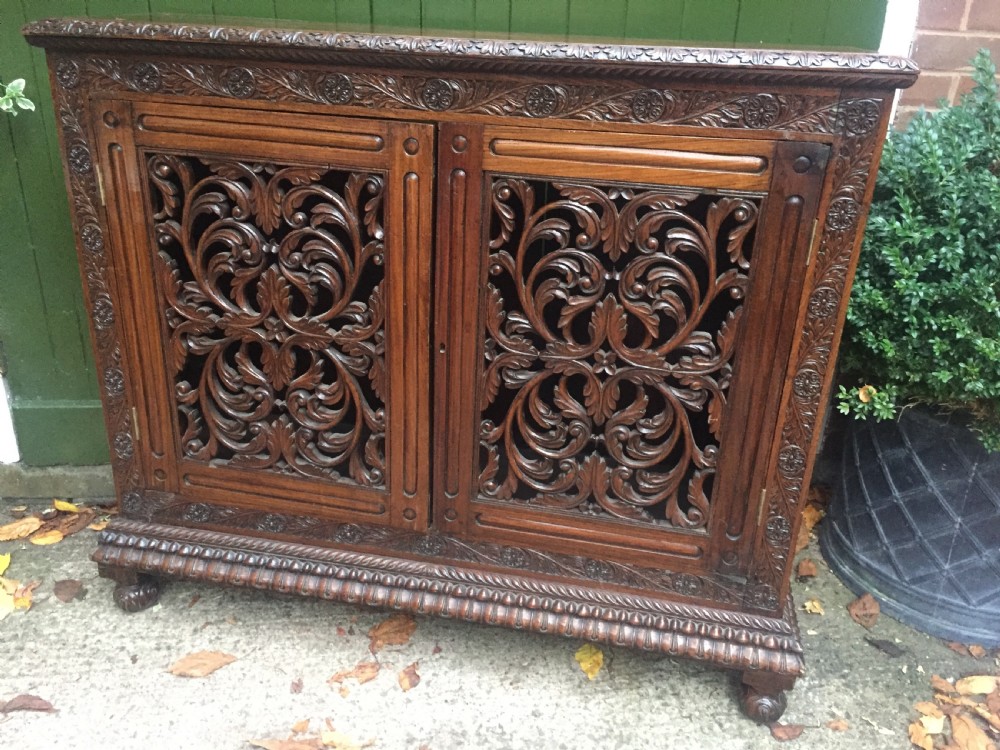Mid C19th Anglo-Indian carved padauk or rosewood dwarf bookcase or side cabinet . View XIV