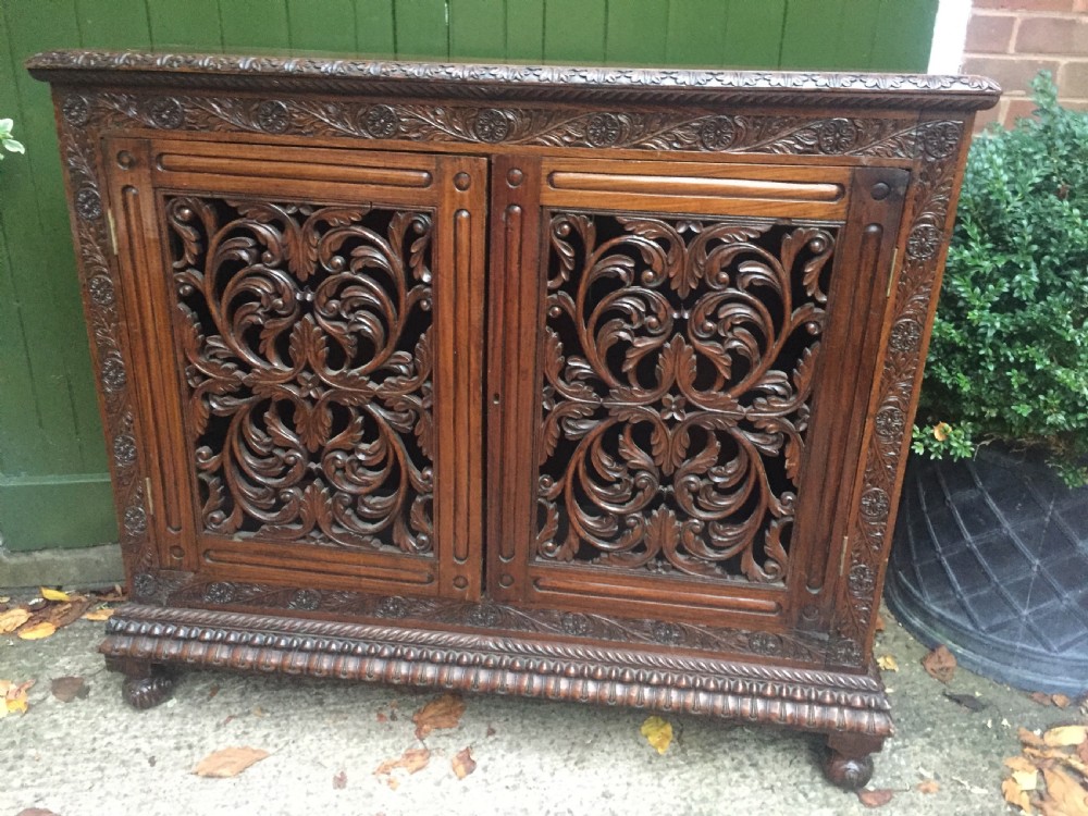 Mid C19th Anglo-Indian carved padauk or rosewood dwarf bookcase or side cabinet . View XV