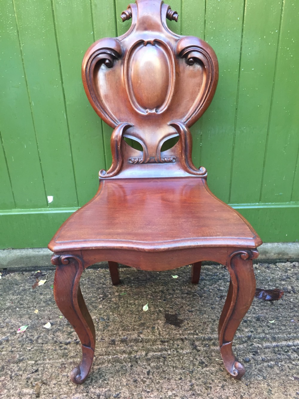 A high quality Victorian mahogany hall chair of particularly bold and flamboyant design  View III