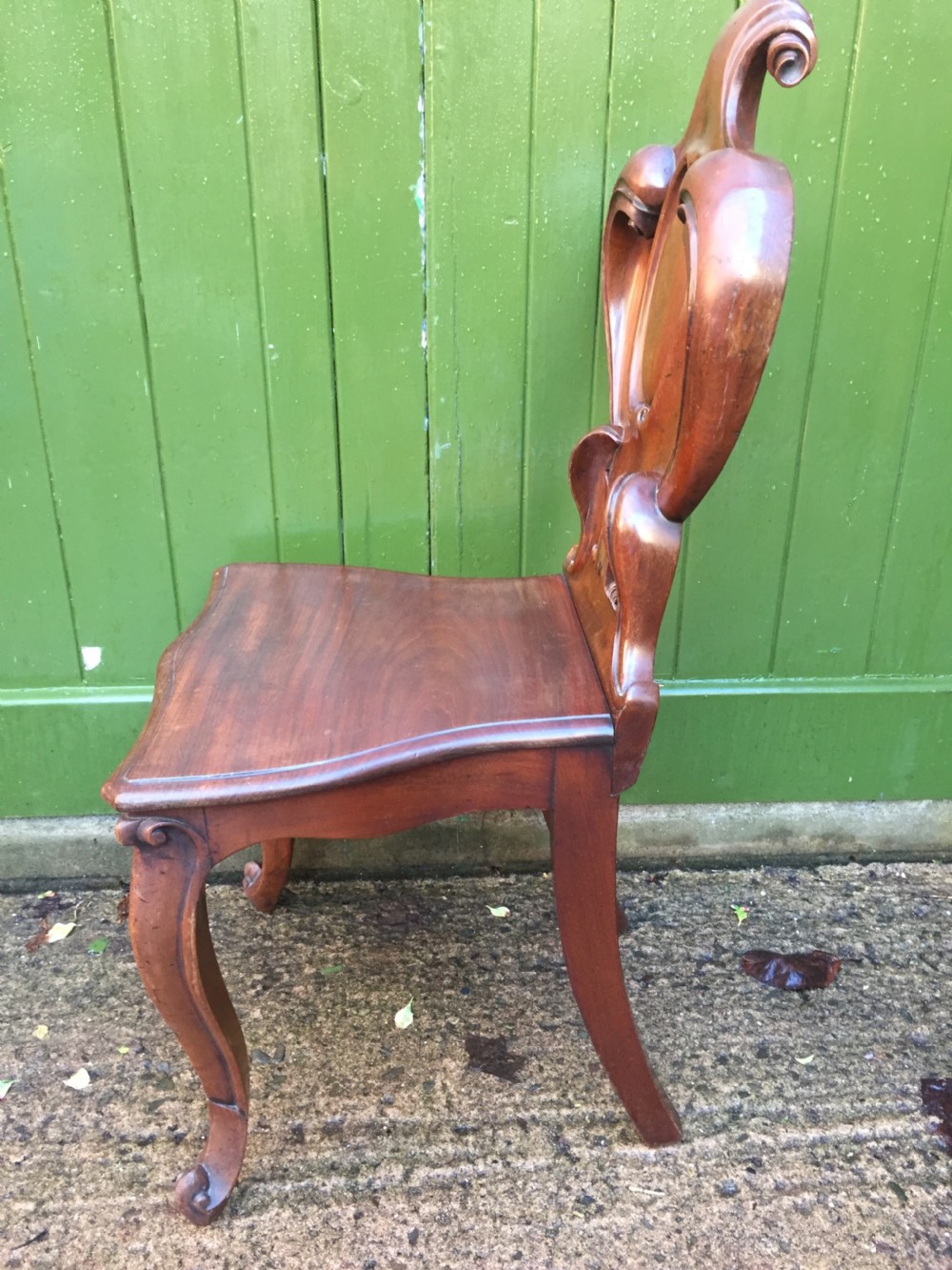 A high quality Victorian mahogany hall chair of particularly bold and flamboyant design  View V